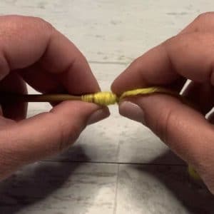 Yarn wrapping a needle